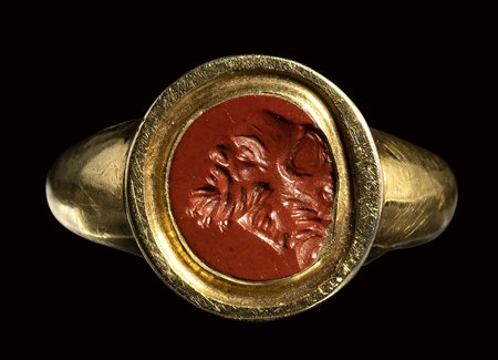 A roman red jasper fragmentary  intaglio mounted on a modern gold ring. Gryllos.<br><br>1st - 2nd century A.D.