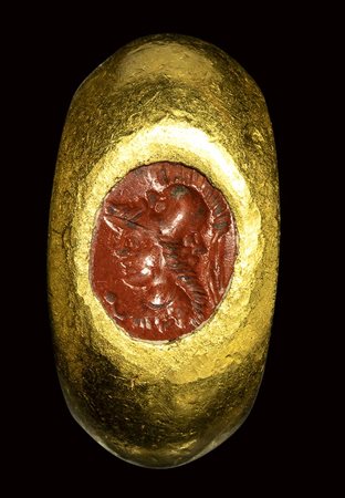 A roman red jasper intaglio mounted in a gold ring. Gryllos.<br><br>2nd century A.D.