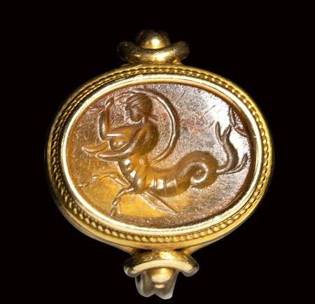 A roman carnelian intaglio set in a gold ring. Tryton.<br><br>2nd - 3rd century A.D.