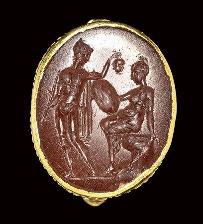 A roman carnelian intaglio set in a gold ring. Perseus and Andromeda. 2nd century A.D. 