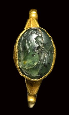 A roman green chalcedony intaglio mounted in a gold ring. Pastoral scene. <br><br>3rd century A.D.