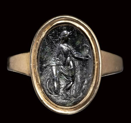 A roman dark green chalcedony intaglio set in a gold ring. Venus Victrix.<br><br>2nd - 3rd century A.D.