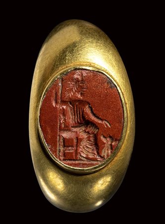 A roman red jasper intaglio set in a gold ring. Hades with Cerberus. <br><br>2nd - 3rd century A.D.