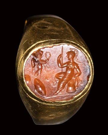A roman carnelian intaglio set in a gold ring. Athena with Nike.<br><br>2nd century A.D. 