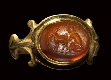 A roman carnelian intaglio set in a gold ring. Pastoral scene.<br><br> 3rd century A.D.