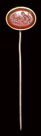 A roman carnelian intaglio set in a gold stick pin. Pastoral scene. <br><br>2nd century A.D. 