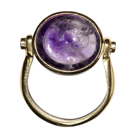 A roman amethyst intaglio set in a modern gold ring with diamonds. Bust of Nereid. <br><br>1st century B.C. - 1st century A.D.