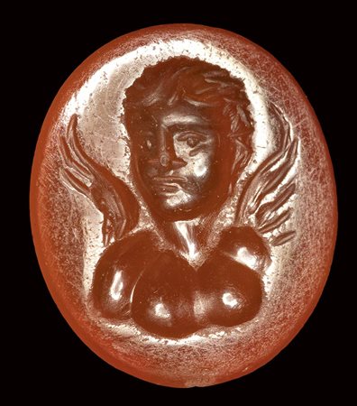 A roman carnelian intaglio. Bust of Eros.<br><br>Late 1st century B.C. - Early 1st century A.D.