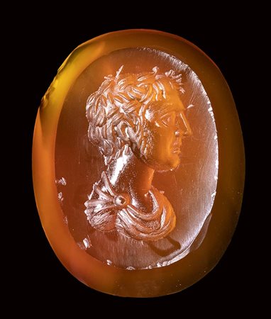 A fine roman carnelian intaglio. Male bust.<br><br>1st - 2nd century A.D.
