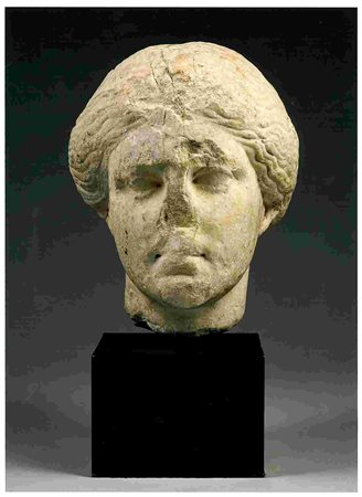 GREEK ATTIC MARBLE HEAD OF A WOMAN Early 4th century BC height (head) cm 31;...