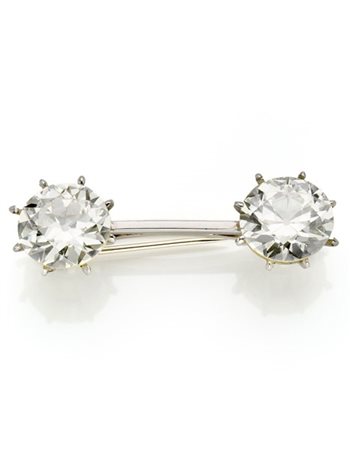 Broche in oro bianco con due diamanti rotondi taglio a brillante di ct. 10,87 e