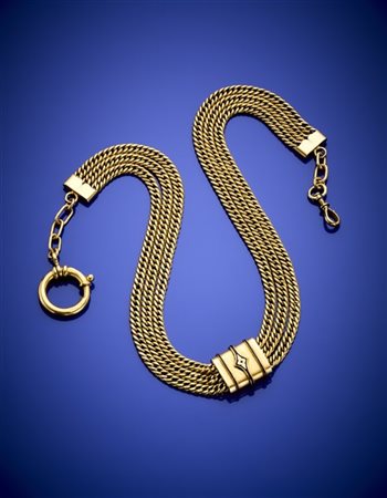 Catena da orologio a tre fili di maglia groumette in oro giallo con distanziato