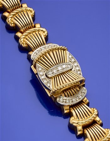 HELIOS
Bracciale modulare in oro giallo, bianco e diamanti con orologio a scomp