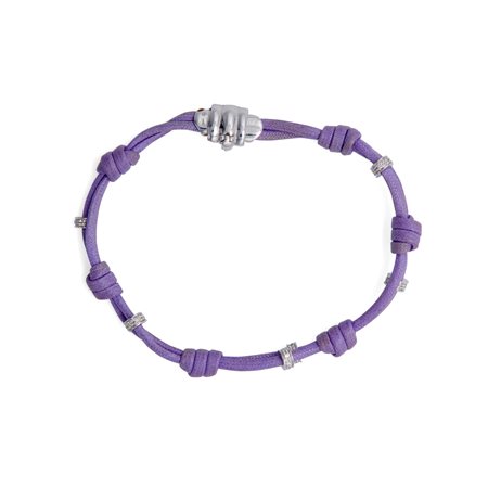 Bracciale in oro bianco e brillanti con laccio in cuoio.