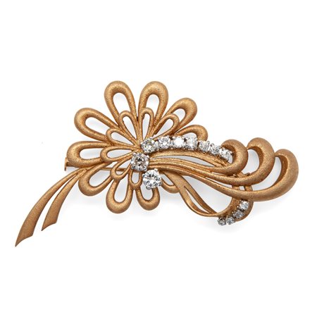 Spilla in oro e brillanti di linea floreale
