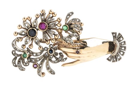 Spilla in oro e argento con diamanti, smerladi, rubini e zaffiri 