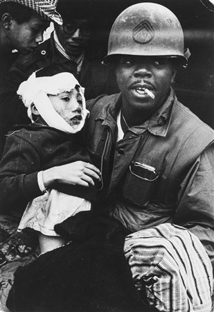 Philip Jones Griffiths (1936-2008)  - Marine with wounded child, 1960s/1970s