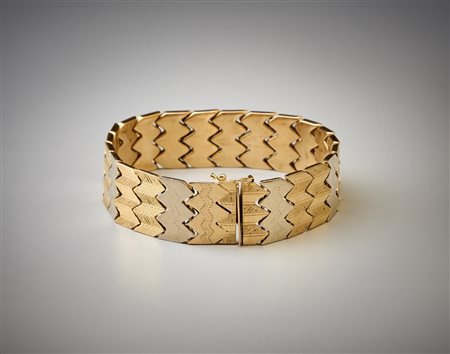  . - Bracciale semirigido  con segmenti geometrici in oro bianco giallo e rosa 750/1000 .