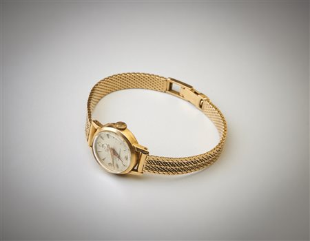  . - Orologio da donna con cassa di forma tonda con cinturino in oro giallo 750/1000.