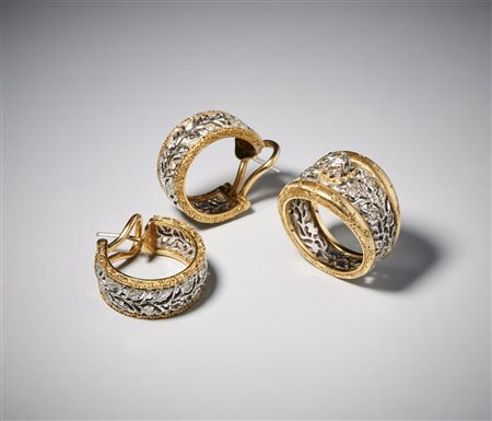BUCCELLATI Federico (1891 - 1965) - Anello e paio di orecchini in oro bianco e giallo 750/1000 con diamante centrale taglio a brillante di circa 0,30 carati  e contorno di  piccoli diamanti bianchi taglio huit huit.