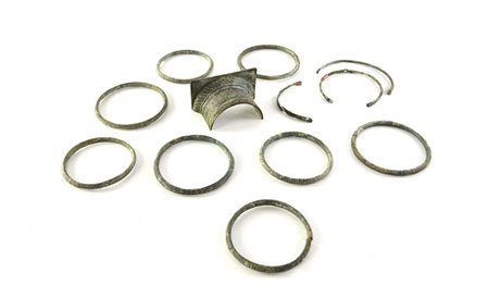 APPLIQUE E ARMILLE DATAZIONE: I-III sec. d. C. MATERIA E TECNICA: bronzo fuso...