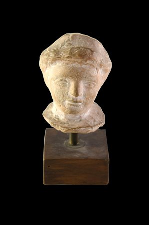 TESTINA DATAZIONE: II-I sec. a. C. MATERIA E TECNICA: argilla figulina...