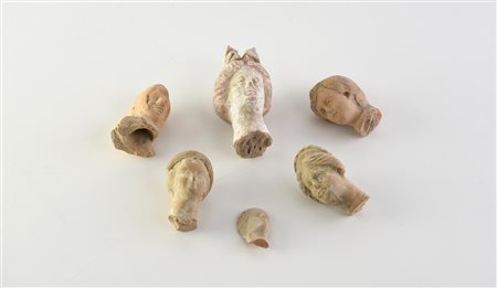 SETTE TESTE DI STATUETTE DATAZIONE: IV-III sec. a. C. MATERIA E TECNICA:...