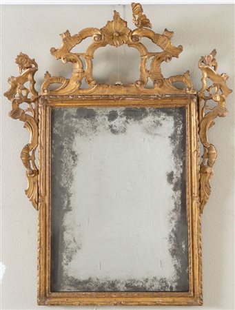 SPECCHIERA in legno intagliato e dorato. Specchio al mercurio originale....