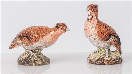 Coppia di pernici in ceramica policroma. XX secolo. Rispettivamente di cm...