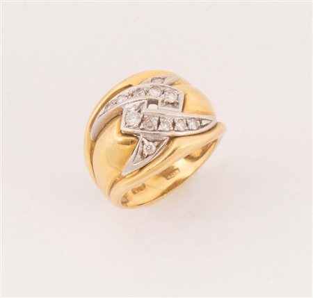 Anello in oro giallo 18k realizzato a fascia decorato da zirconi. Peso...