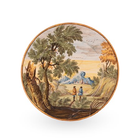 Manifattura castellana del XVIII secolo ( - ) 
Piattello in maiolica decorato con un paesaggio agreste 
 Ø cm 17,4