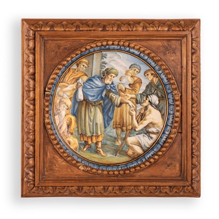 Manifattura Gentili, Castelli, metà del XVIII secolo ( - ) 
Tondo in maiolica decorata in policromia con la rappresentazione della parabola del ritorno del figliol prodigo in cornice lignea scolpita 
 Ø cm 18; con cornice cm 25x25