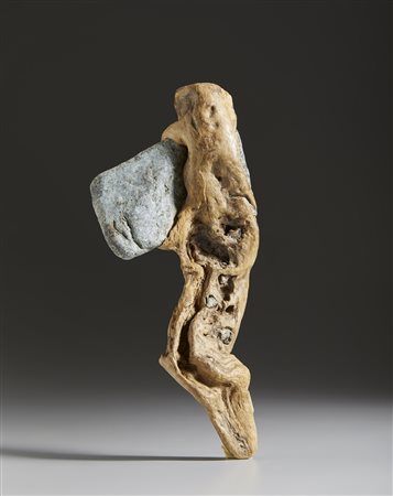  . - Ascia in pietra con manico.