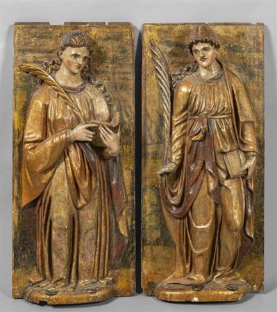 Santi, coppia di altorilievi in legno intagliato, 