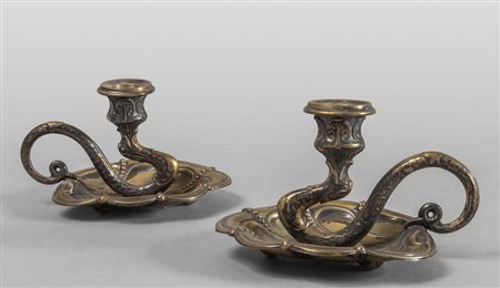 Coppia di bugie in argento raffiguranti 