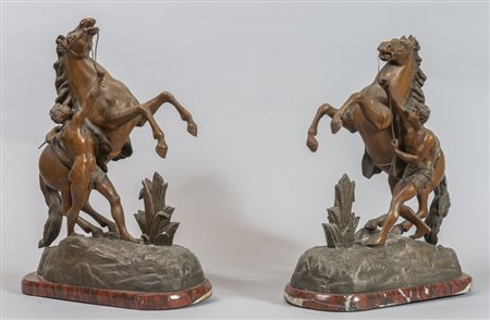 # Coppia di gruppi in metallo raffiguranti 