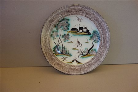 Piatto in maiolica, decorazione a spugnato 