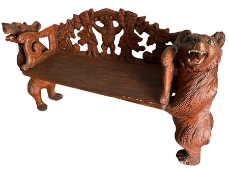 panca in legno scolpita, sostenuta da orsi, con 