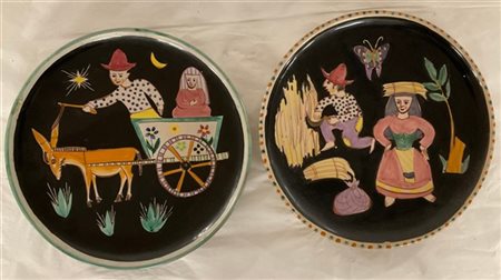 Manifattura Musa
Coppia di piatti decorativi in terracotta dipinti in policromi