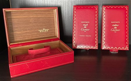 Lotto composto da tre scatole di cui due Cartier Parfum e una Rolex (scatola Ro