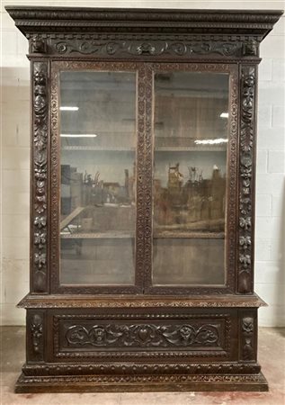 Mobile libreria a struttura architettonica, due ante a vetri ed un cassetto nel