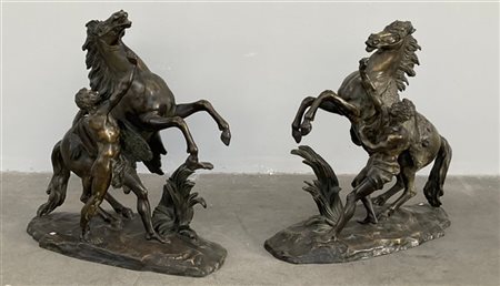 Da Guillaume Coustou "Cavalli di Marly" due gruppi in bronzo (h cm 58) firmati