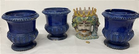 Lotto composto da tre fioriere in ceramica smaltata blu ed una fioriera in cera