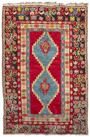 Tappeto Mudjiur, Anatolia, fine secolo XIX. Decoro con due medaglioni romboidal