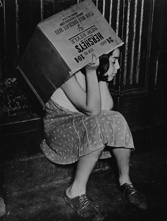 Weegee (1899-1968)  - Girl with Hershey's box, 1940s