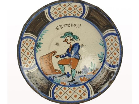 Piatto in maiolica Montelupo Fiorentino. Epoca XVII secolo. Raffigura il mese...