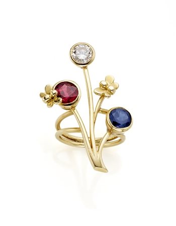 Anello a fiore stilizzato con un rubino di ct. 1,87 circa, uno zaffiro di ct. 1