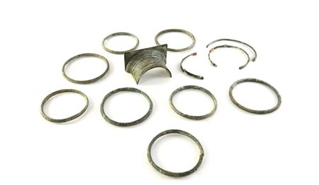 APPLIQUE E ARMILLE DATAZIONE: I-III sec. d. C. MATERIA E TECNICA: bronzo fuso...