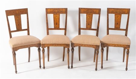 Quattro sedie lastronate ed intarsiate in noce, acero e varie essenze....