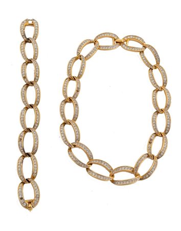 NINA RICCI Parure composta da collier e bracciale a catena in metallo dorato...